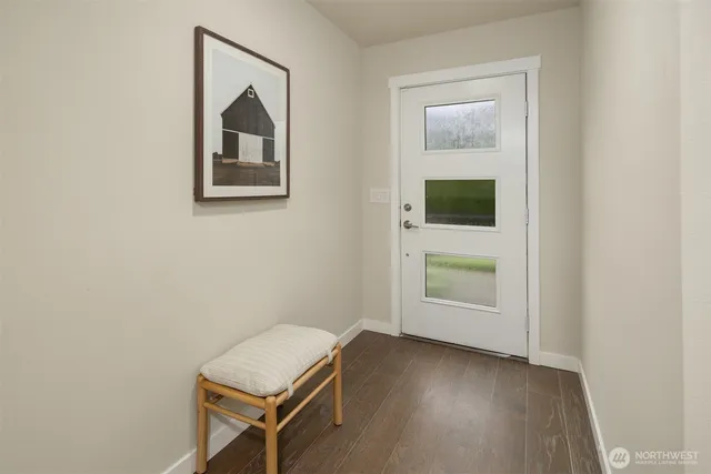 a view of room with window and wooden floor