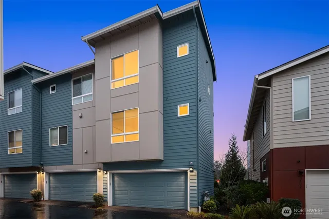 a aerial view of a house with a yard and balcony
