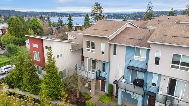 a aerial view of residential houses with cars parked