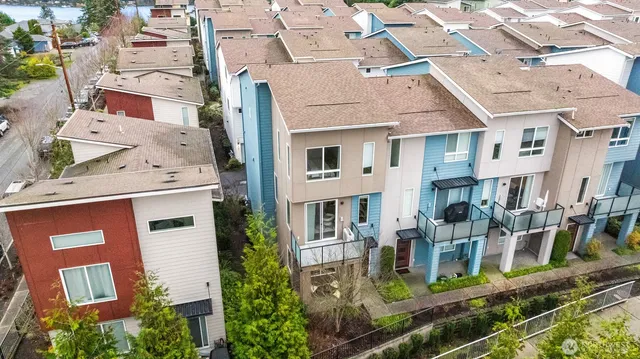 an aerial view of a residential apartment building with a yard
