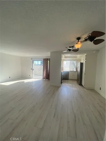 a kitchen with stainless steel appliances granite countertop a refrigerator a sink a stove and island