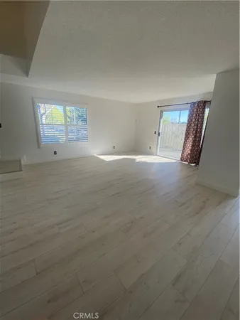 a view of a livingroom with wooden floor