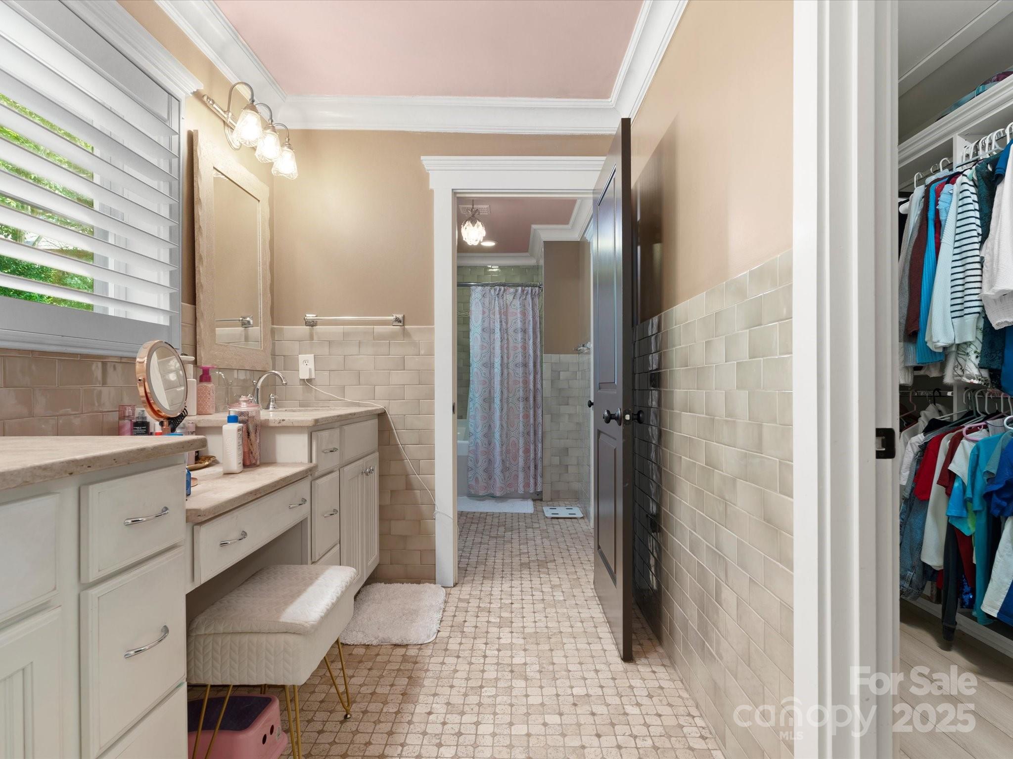 315 Mountainview Drive Charlotte, NC 28270 - Photo 13 of 34 a bathroom with a double vanity sink a toilet and a shower