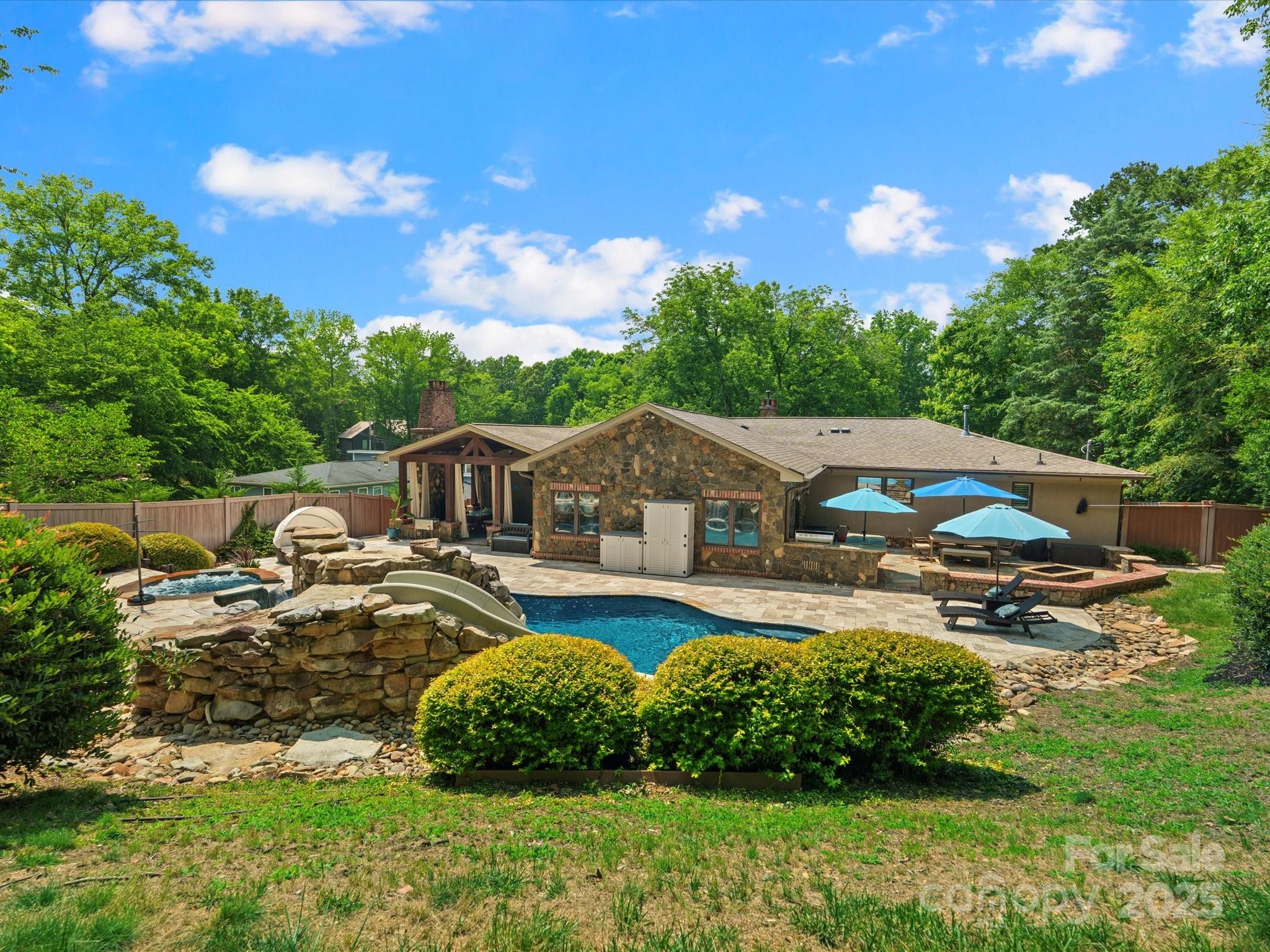 315 Mountainview Drive Charlotte, NC 28270 - Photo 17 of 34 a view of a house with swimming pool and yard