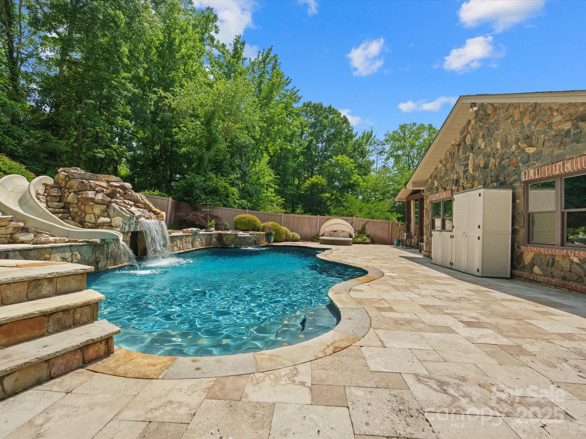 315 Mountainview Drive Charlotte, NC 28270 - Photo 18 of 34 a view of a backyard with sitting area