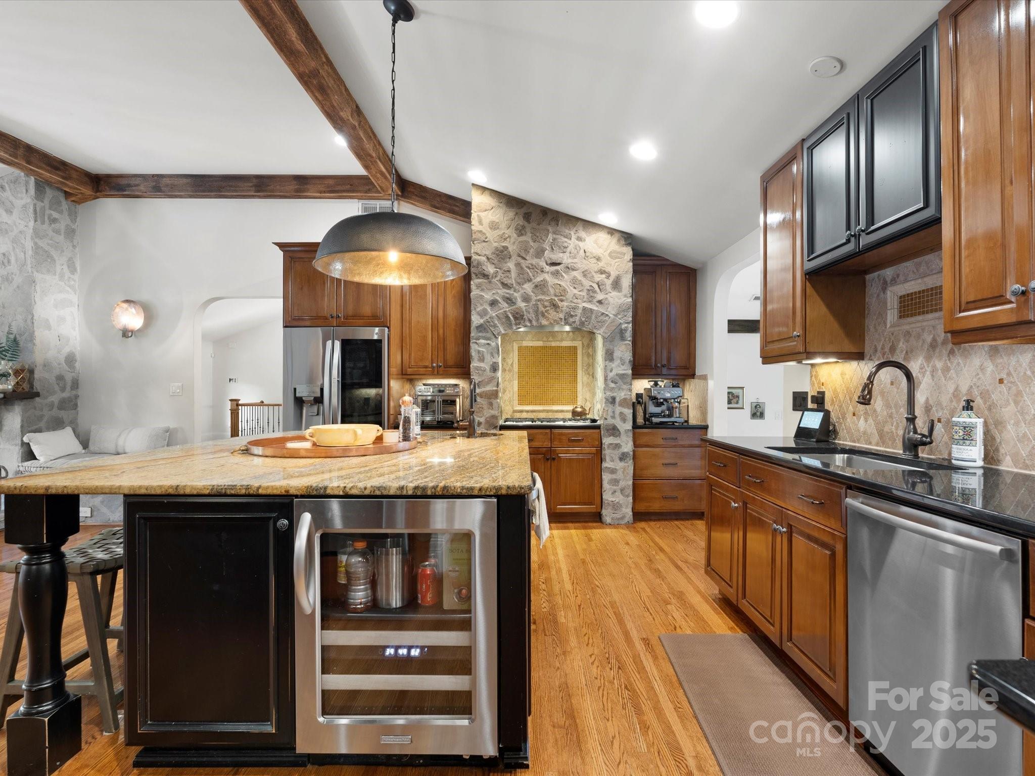 315 Mountainview Drive Charlotte, NC 28270 - Photo 5 of 34 a kitchen with kitchen island granite countertop a sink stove and cabinets