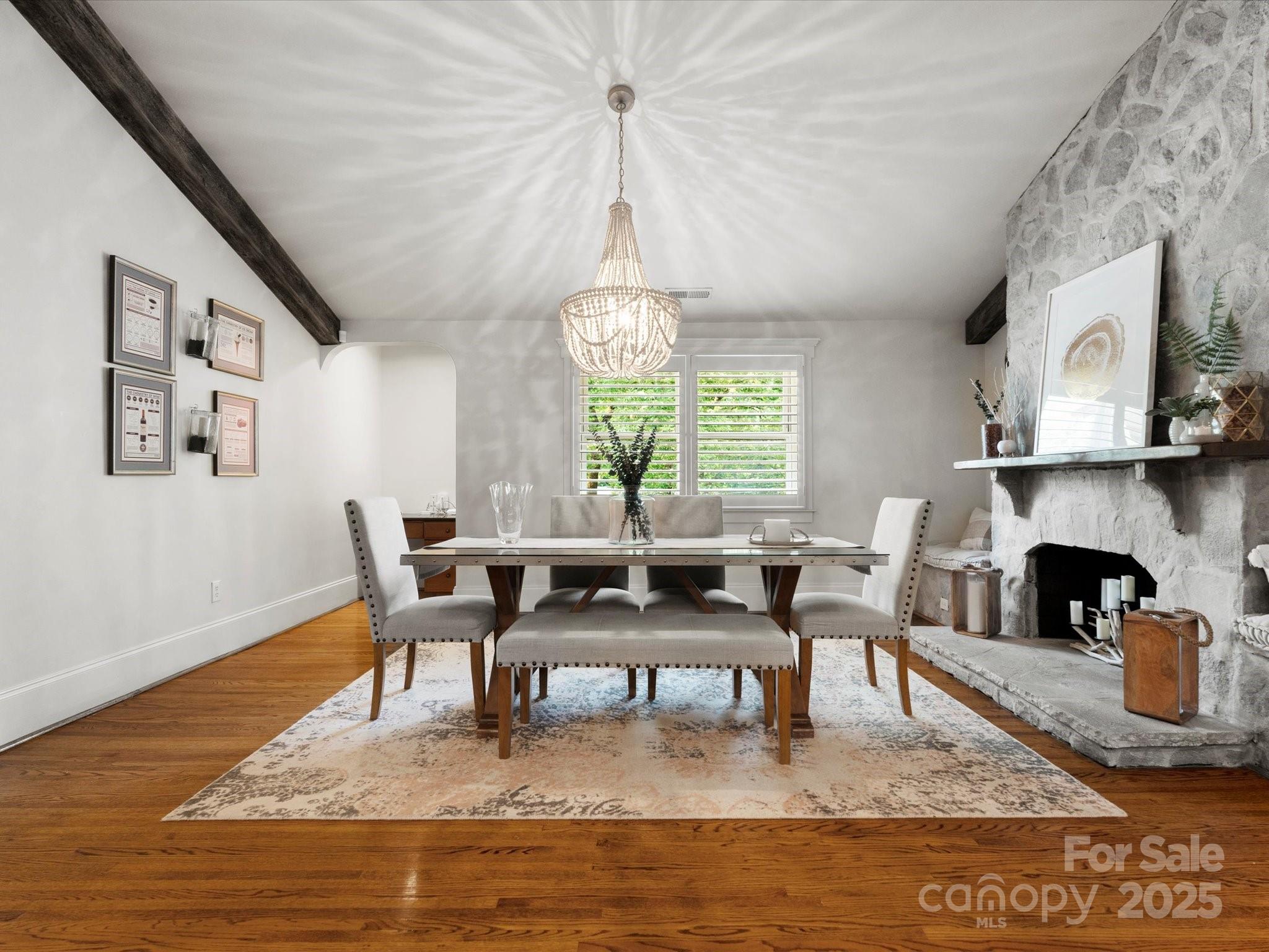 315 Mountainview Drive Charlotte, NC 28270 - Photo 7 of 34 a living room with furniture a large window and a table