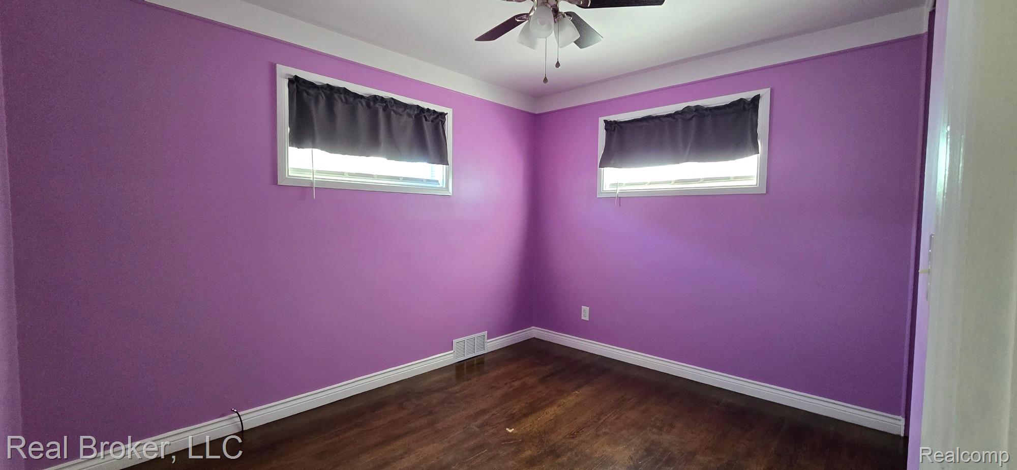 23401 Filmore Street Taylor, MI 48180 - Photo 14 of 16 Room featuring wood-finish flooring, white trim, and a ceiling fan