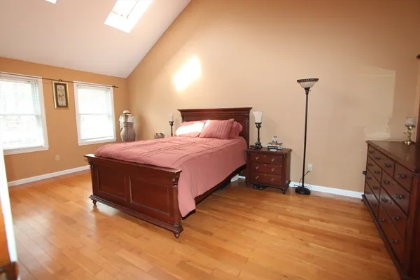 a living room with a bed furniture and a large window