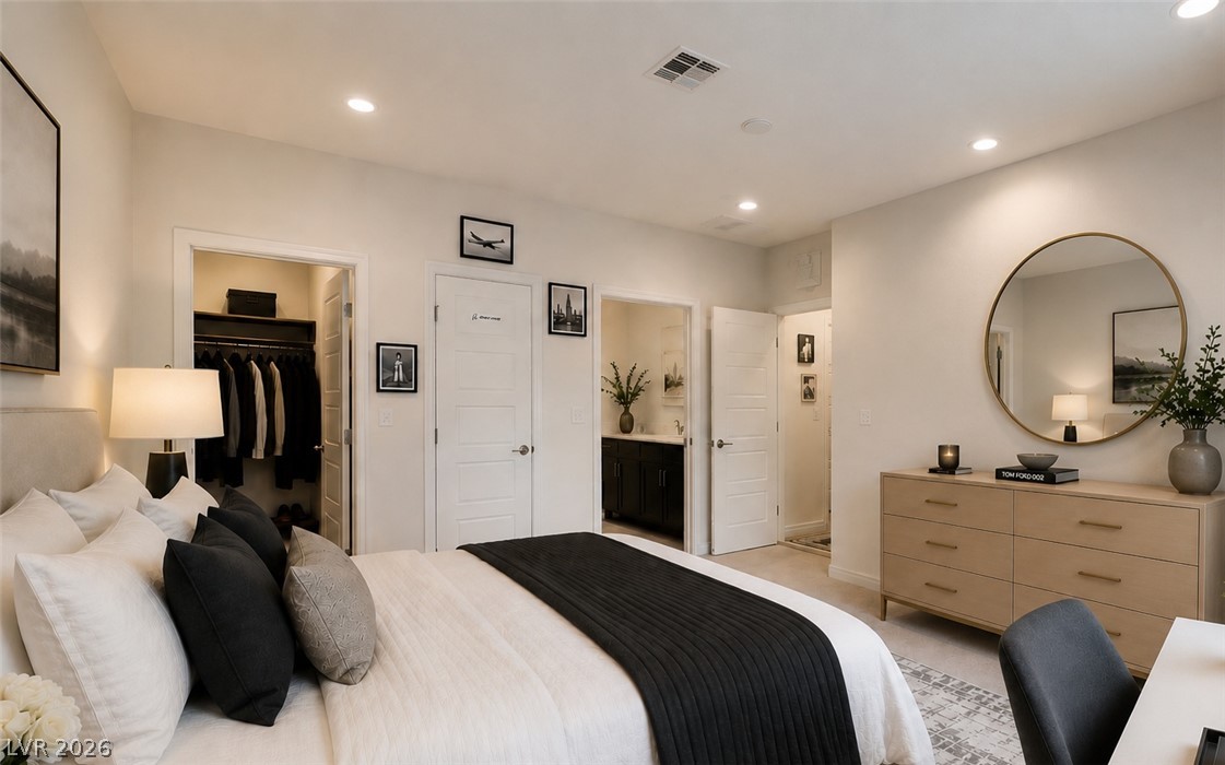 7330 North Decatur Boulevard, Unit 6 North Las Vegas, NV 89084 - Photo 11 of 42 A restful chamber offering both privacy and direct access to a well-appointed private bath and closet space.
