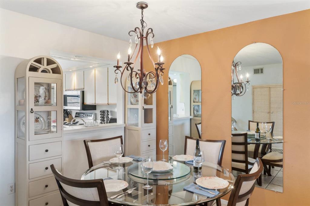 2275 South McCall Road, Unit 102 Englewood, FL 34224 - Photo 11 of 48 a view of a dining room with furniture