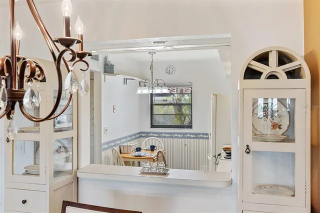 a bathroom with a sink a mirror and a window