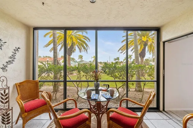 a view of a chairs and table in a room