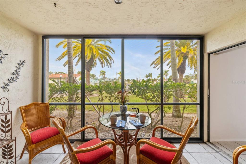 2275 South McCall Road, Unit 102 Englewood, FL 34224 - Photo 16 of 48 a view of a chairs and table in a room
