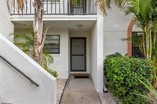 a front view of a house with a glass door