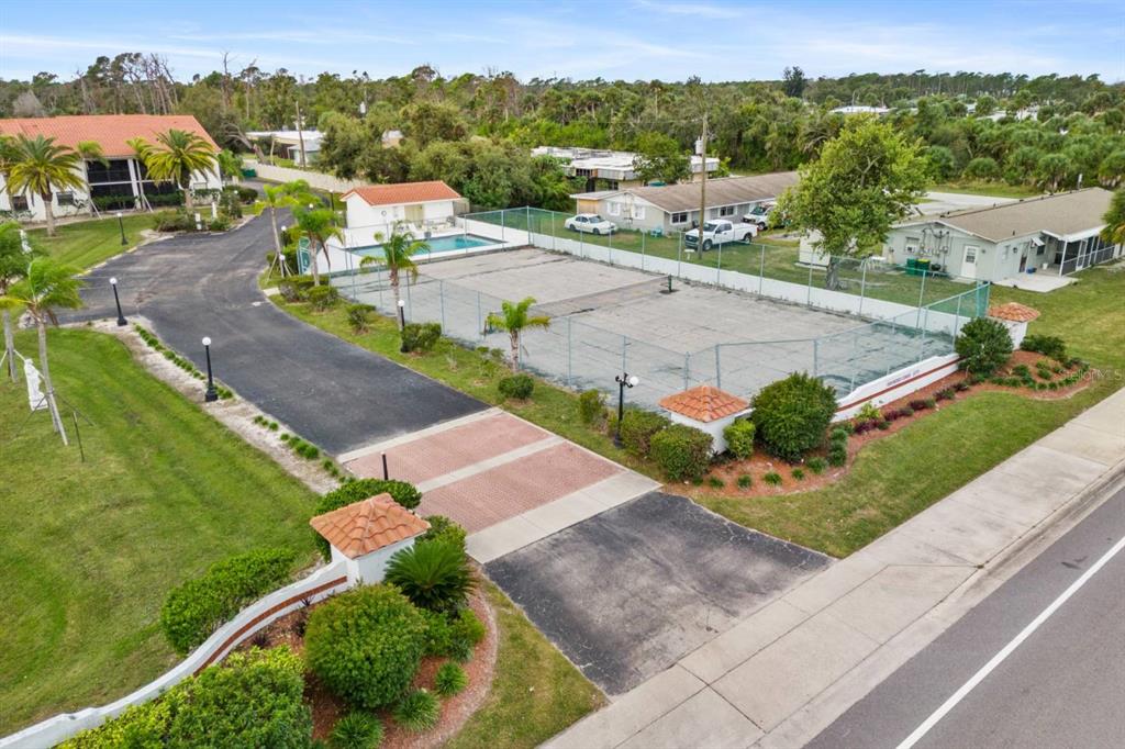 2275 South McCall Road, Unit 102 Englewood, FL 34224 - Photo 26 of 48 an aerial view of a house with a garden