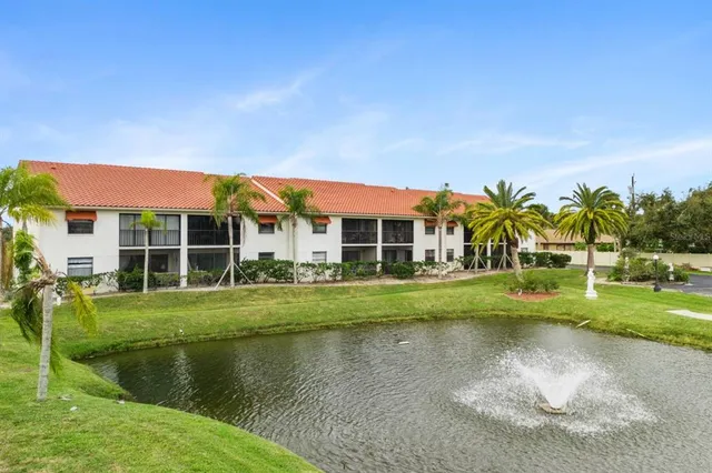 a view of house with outdoor space and swimming pool