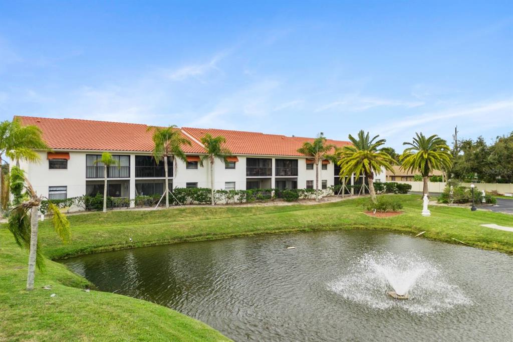 2275 South McCall Road, Unit 102 Englewood, FL 34224 - Photo 32 of 48 a view of house with outdoor space and swimming pool