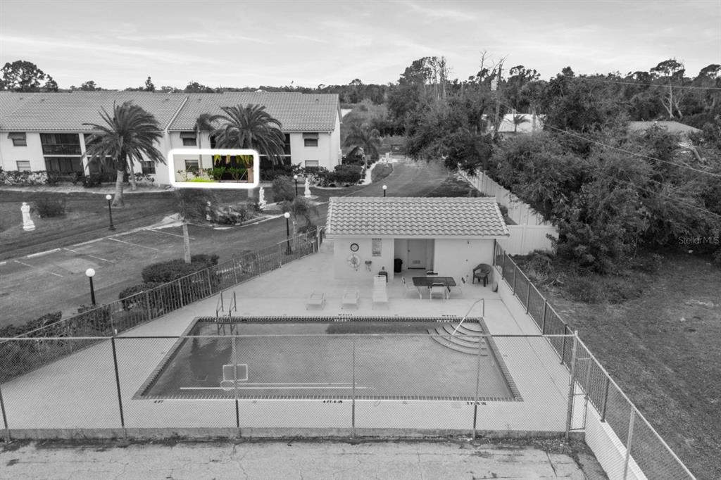 2275 South McCall Road, Unit 102 Englewood, FL 34224 - Photo 33 of 48 a view of a house with a yard