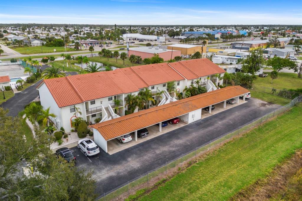 2275 South McCall Road, Unit 102 Englewood, FL 34224 - Photo 36 of 48 an aerial view of a house with a garden