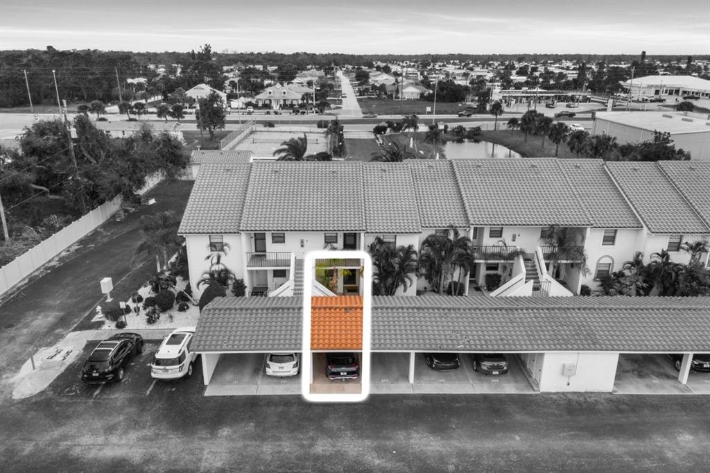 2275 South McCall Road, Unit 102 Englewood, FL 34224 - Photo 37 of 48 an aerial view of a house with a yard