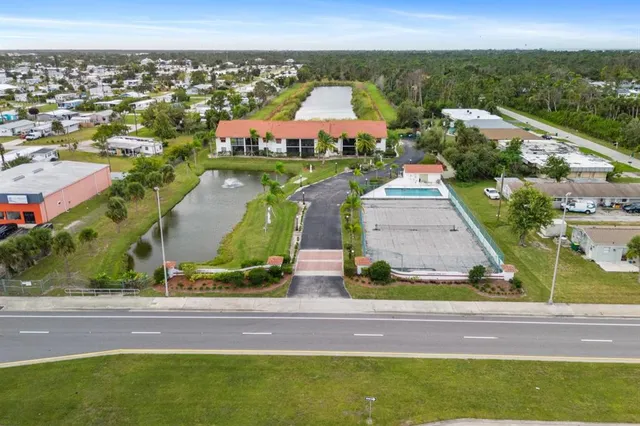 an aerial view of residential houses with outdoor space and street view