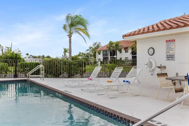 a view of a swimming pool with a terrace