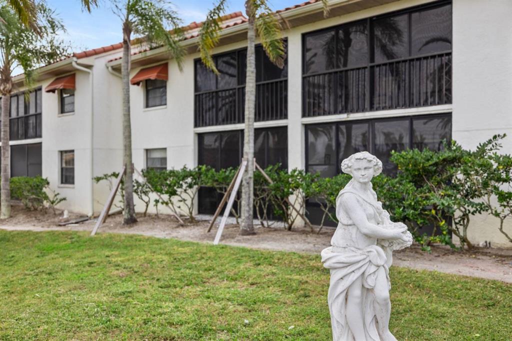 2275 South McCall Road, Unit 102 Englewood, FL 34224 - Photo 45 of 48 a view of a house with backyard porch and sitting area