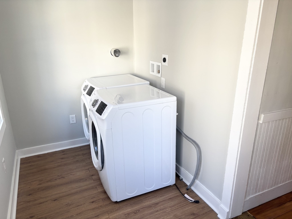 73 Dent Street, Unit 1 Boston, MA 02132 - Photo 24 of 36 a utility room with dryer and washer
