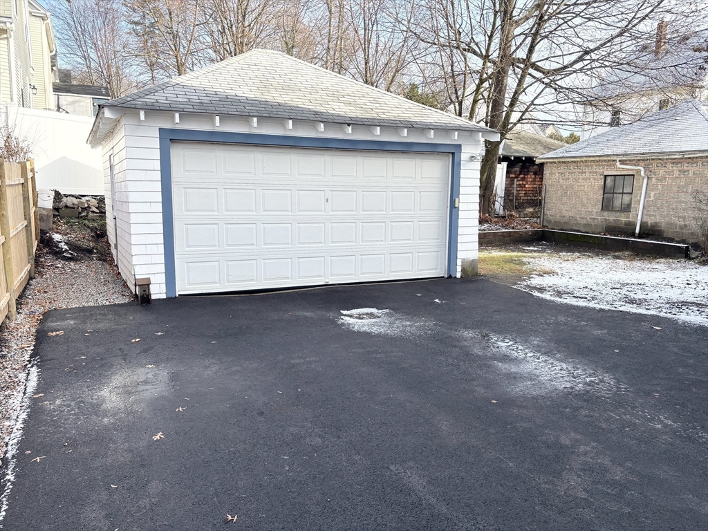 73 Dent Street, Unit 1 Boston, MA 02132 - Photo 27 of 36 a view of a house with a garage