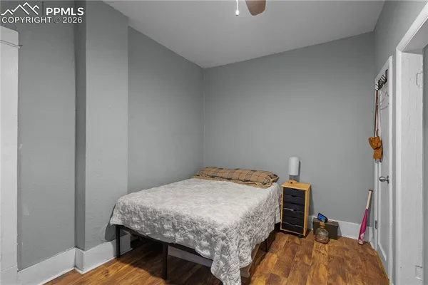 a bedroom with a bed and a table in it