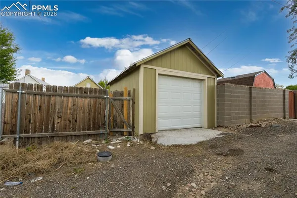 a view of barn with a small yard