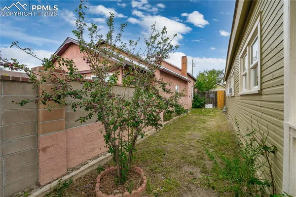 a view of a house with a tree