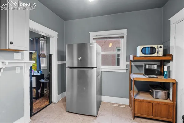 a room with furniture a washer and dryer