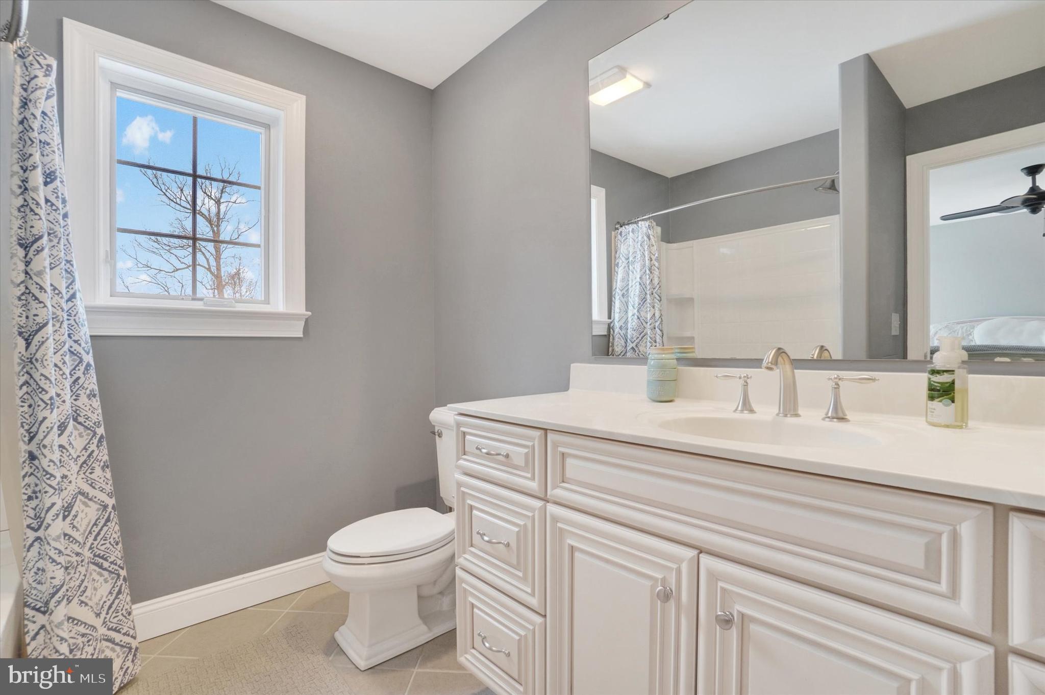 130 Valmere Path York, PA 17403 - Photo 31 of 56 a bathroom with a granite countertop sink a toilet and a mirror