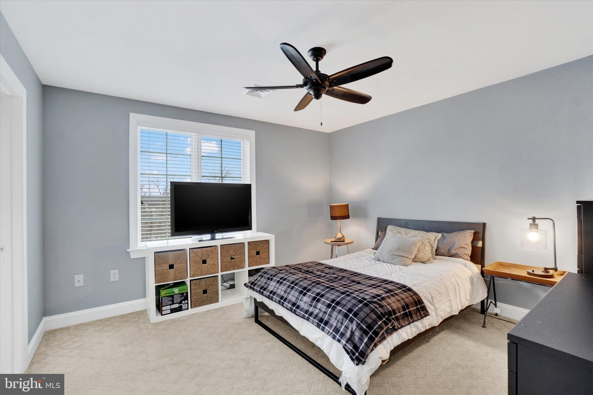 130 Valmere Path York, PA 17403 - Photo 32 of 56 a bedroom with a bed and a flat screen tv