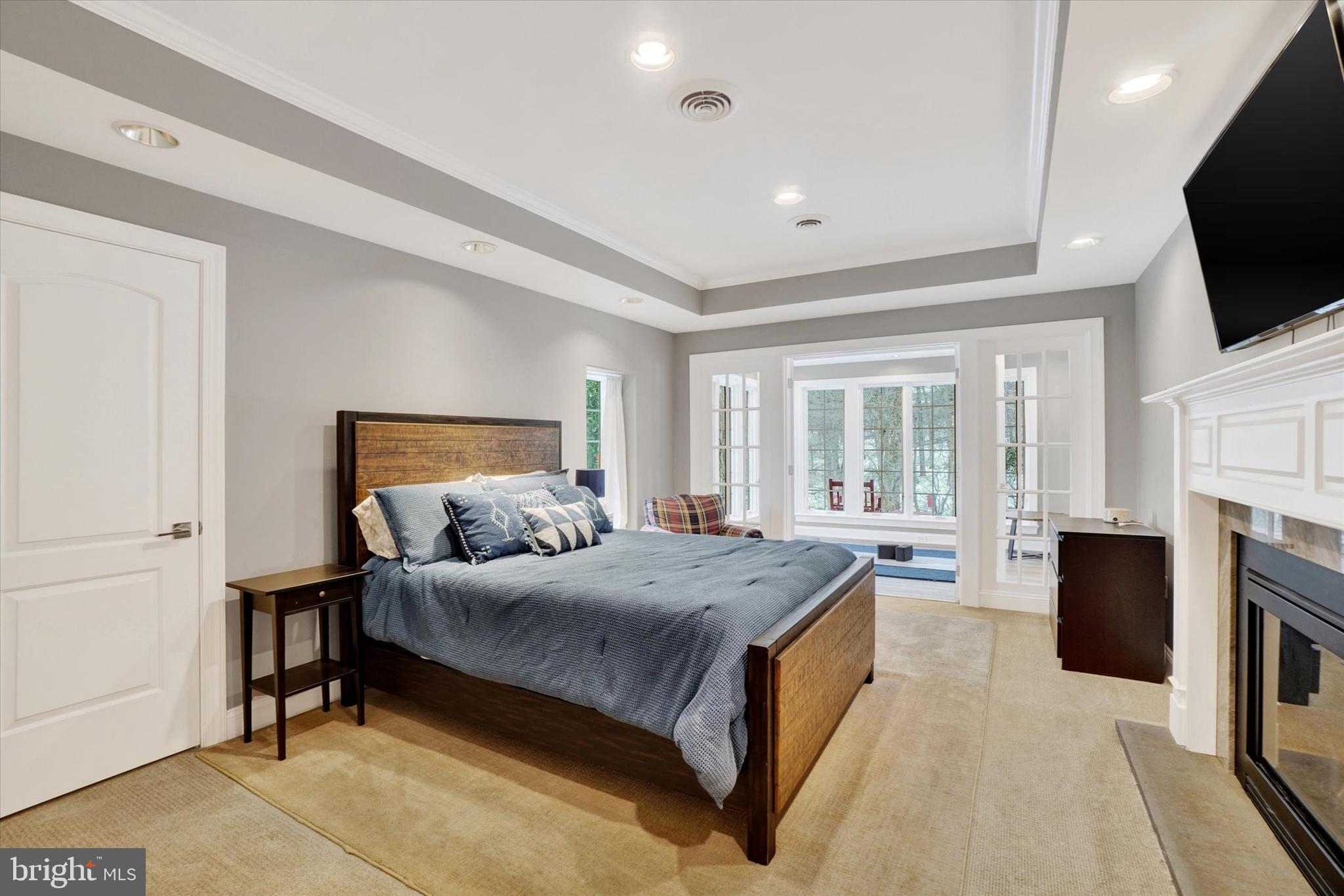 130 Valmere Path York, PA 17403 - Photo 42 of 56 a spacious bedroom with a large bed and a flat screen tv