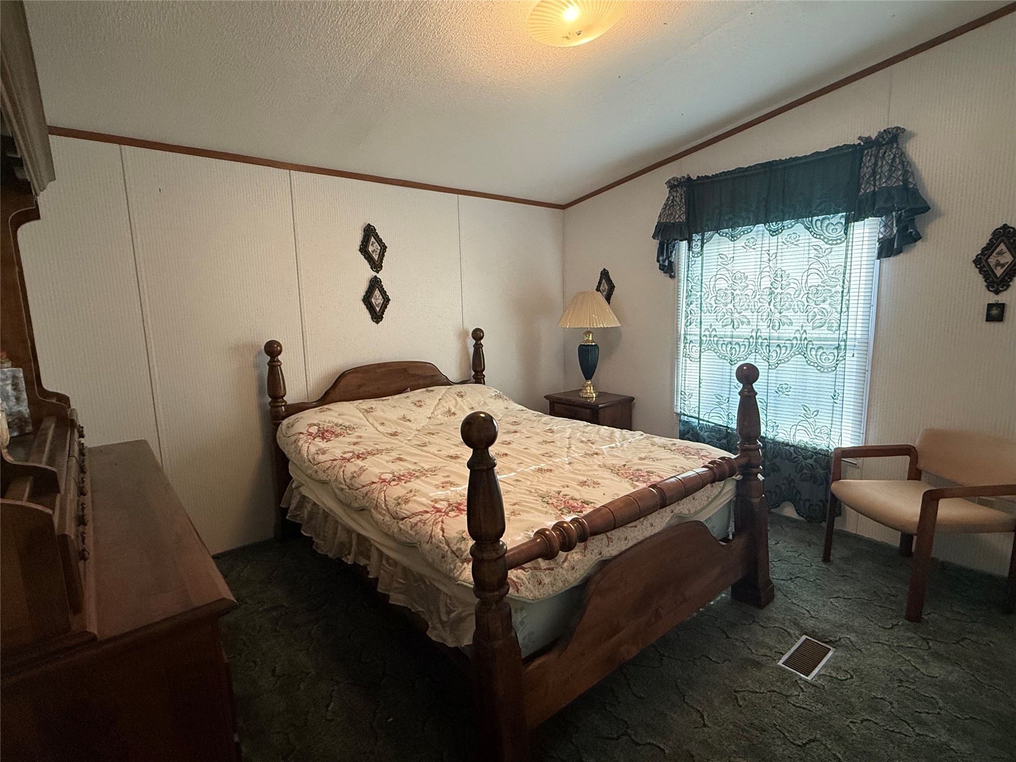 305 Canadian Drive Trinity, TX 75862 - Photo 23 of 29 a bed sitting in a bedroom next to a window