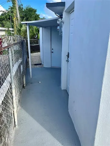 a kitchen with granite countertop a sink stainless steel appliances and cabinets