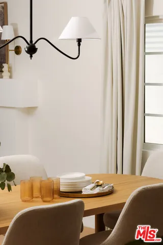 a room with a table and chairs