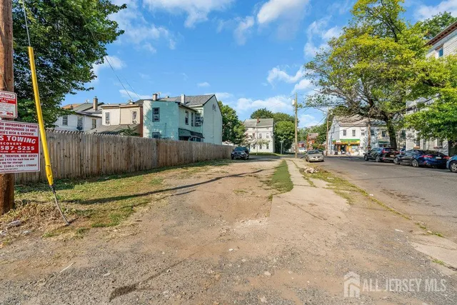 a view of street with parked cars