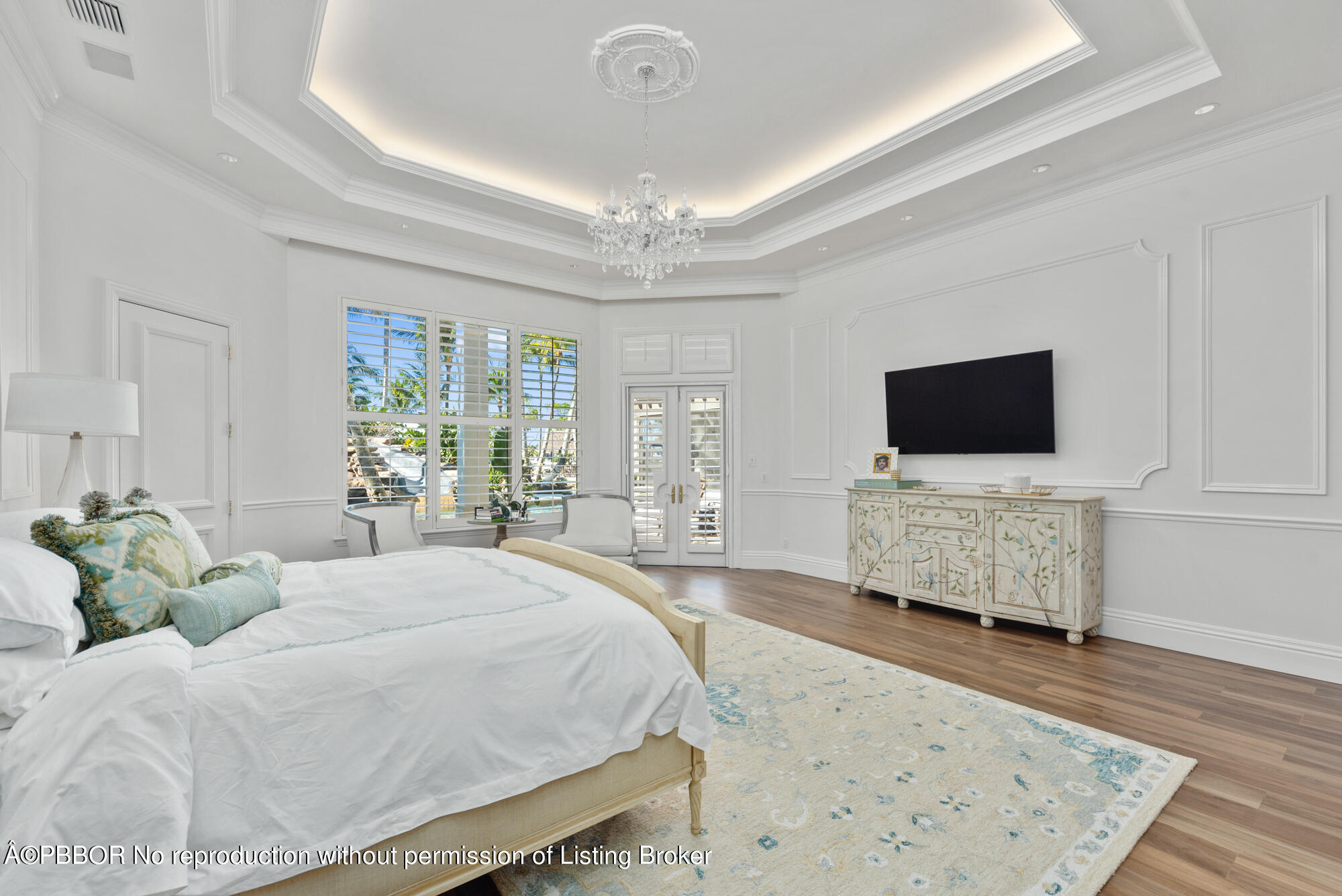 314 West Riverside Drive Jupiter, FL 33469 - Photo 26 of 92 a spacious bedroom with a bed and a flat screen tv