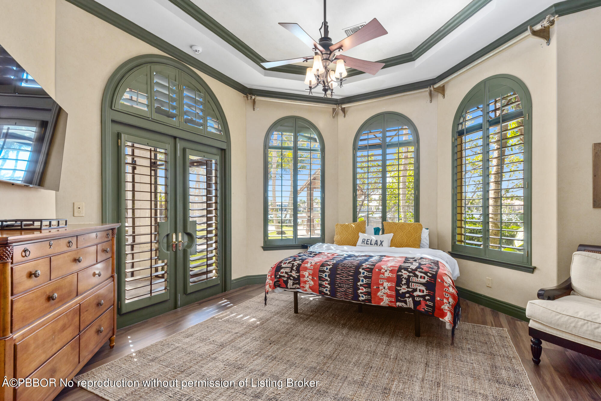 314 West Riverside Drive Jupiter, FL 33469 - Photo 71 of 92 a bedroom with a bed and a chandelier