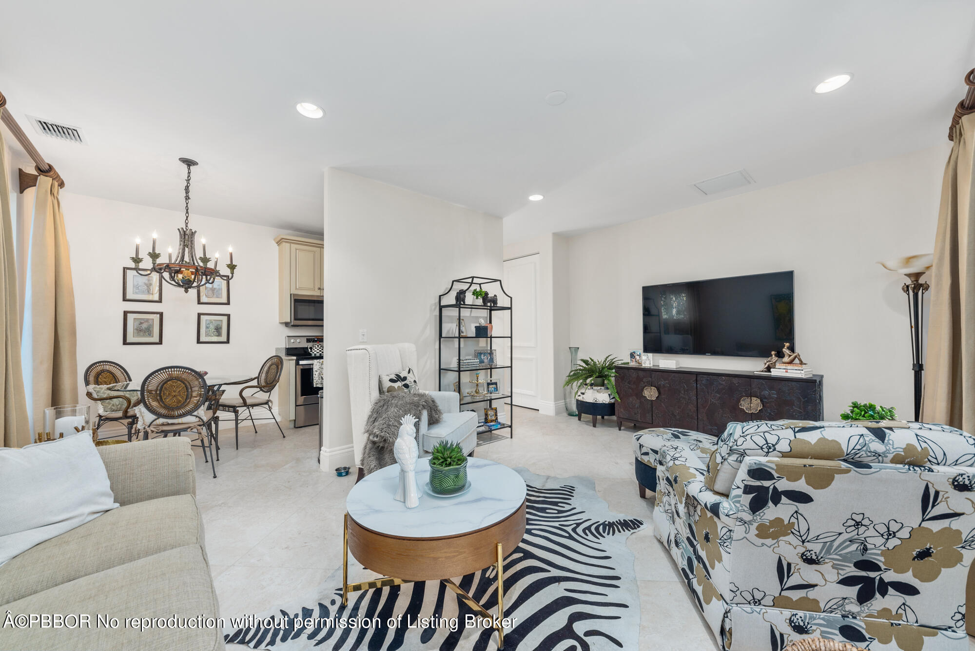 314 West Riverside Drive Jupiter, FL 33469 - Photo 77 of 92 a living room with furniture and a flat screen tv