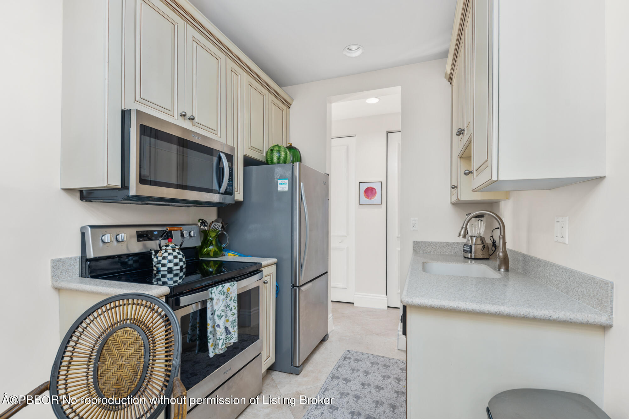 314 West Riverside Drive Jupiter, FL 33469 - Photo 78 of 92 a kitchen with stainless steel appliances granite countertop a sink a stove a refrigerator and cabinets