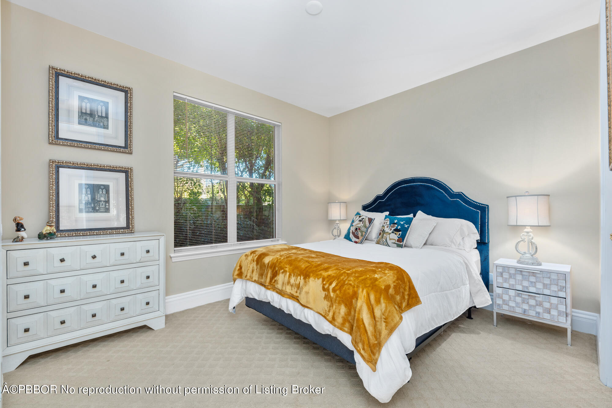 314 West Riverside Drive Jupiter, FL 33469 - Photo 79 of 92 a bedroom with a bed a lamp and a window