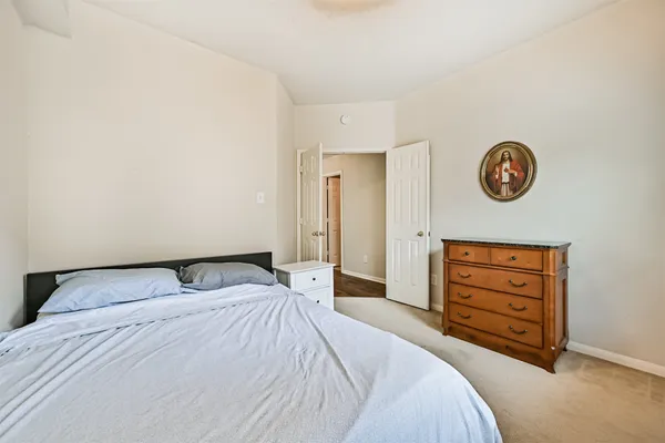 a bedroom with a bed and a closet