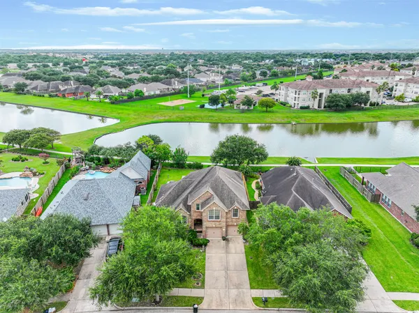 an aerial view of a city with lawn chairs