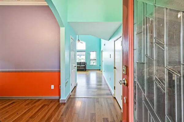 a view of balcony with wooden floor