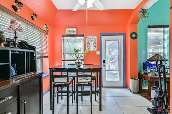 a dining room with furniture and window
